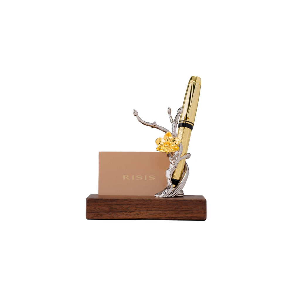 Risis 1974 Doritaenopsis Pen and Name Card Holder - A golden pen with a black band is nested in a silver branch sculpture with a golden flower, all mounted on a polished wooden base with a nameplate.