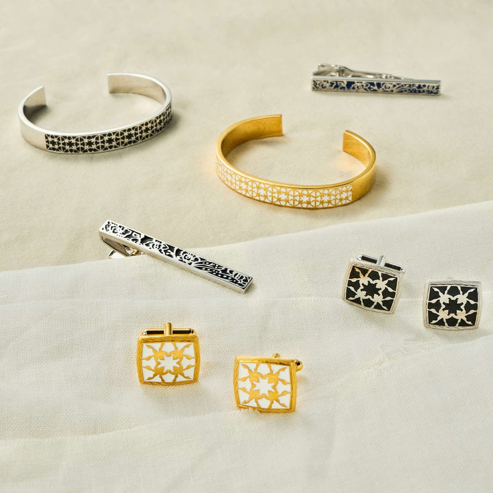 RISIS Peranakan Orchid Tie Clips, Cufflinks and Bangles - encapsulated in 18K Gold and Rhodium with White and Black Enamel.