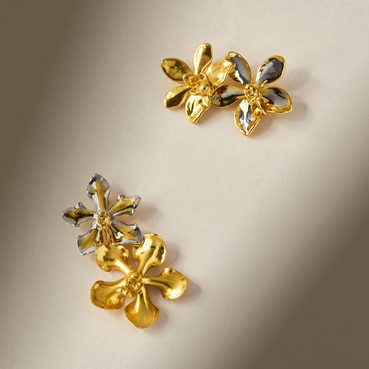 Risis Aeridovanda And Doritaenopsis Orchid Brooch - These are three-dimensional, gold-toned floral earrings with shiny petals, some featuring a contrasting silver finish, artistically crafted to resemble blooming flowers.