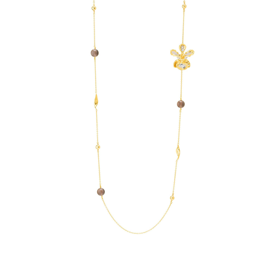 Risis Oncidium Blossom Necklace (G) - A delicate gold necklace featuring evenly interspersed taupe-colored beads and elegant, leaf-like links, culminating in a central flower-shaped pendant with shimmering accents.