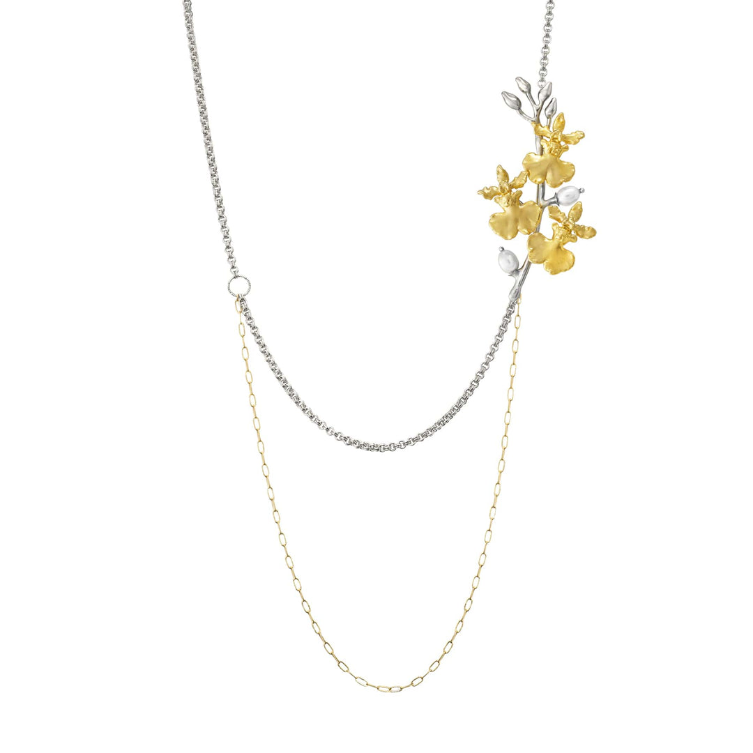 Risis Oncidium Symphony Necklace with Pearls - A dual-stranded necklace, one silver and one gold, adorned with a cluster of textured golden flowers and small silver leaves, creating an elegant, asymmetrical design.