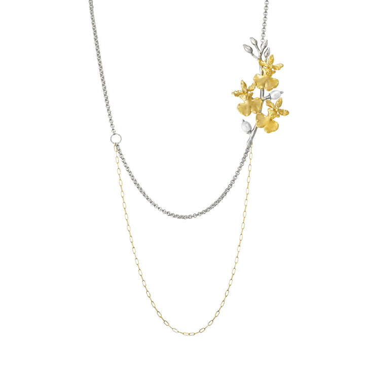 Risis Oncidium Symphony Necklace with Pearls - A dual-stranded necklace, one silver and one gold, adorned with a cluster of textured golden flowers and small silver leaves, creating an elegant, asymmetrical design.