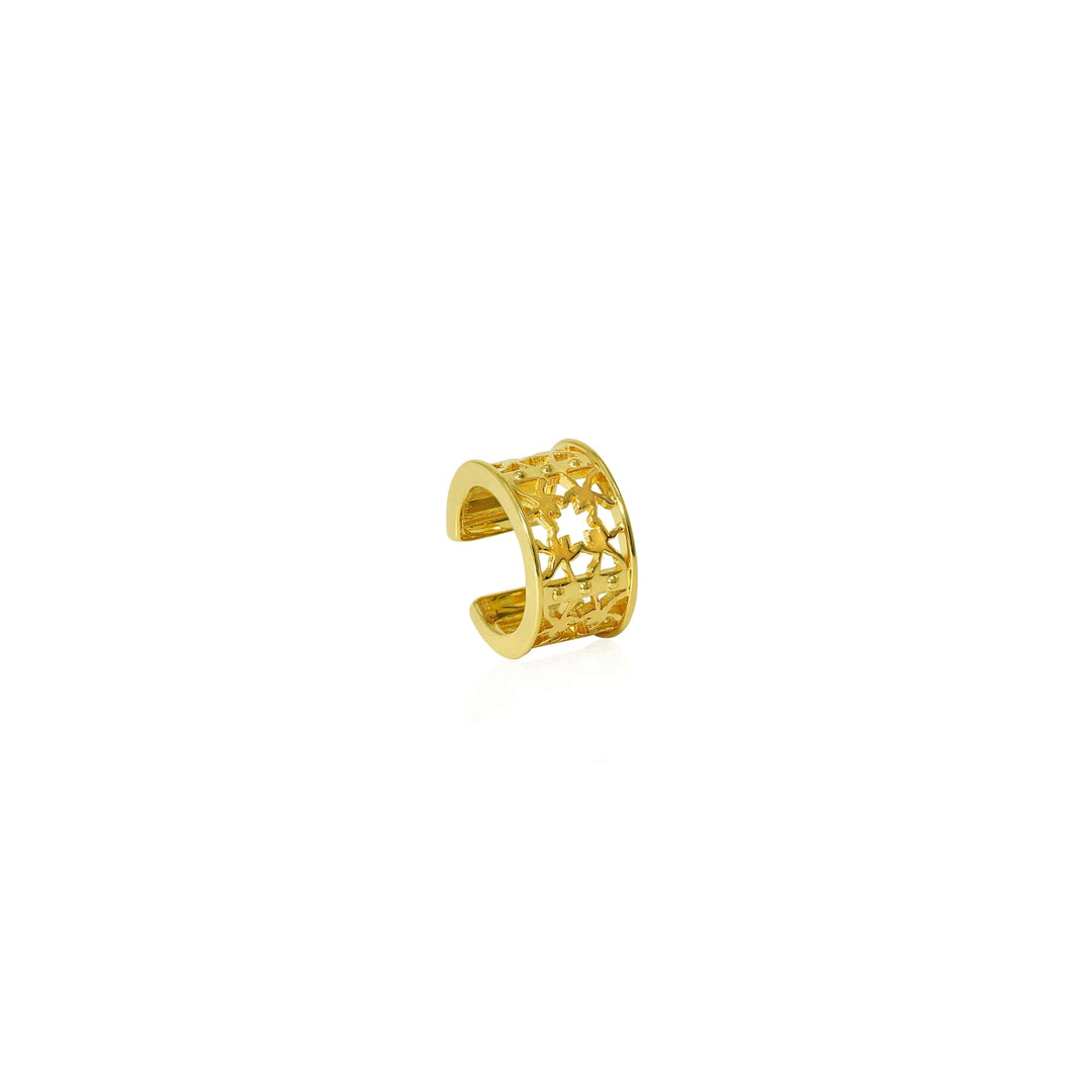 Risis Peranakan Orchid Ear Cuff (G) - A gold ring with intricate cut-out patterns resembling stars and floral motifs, glistening, with an open band design for adjustable wearing.