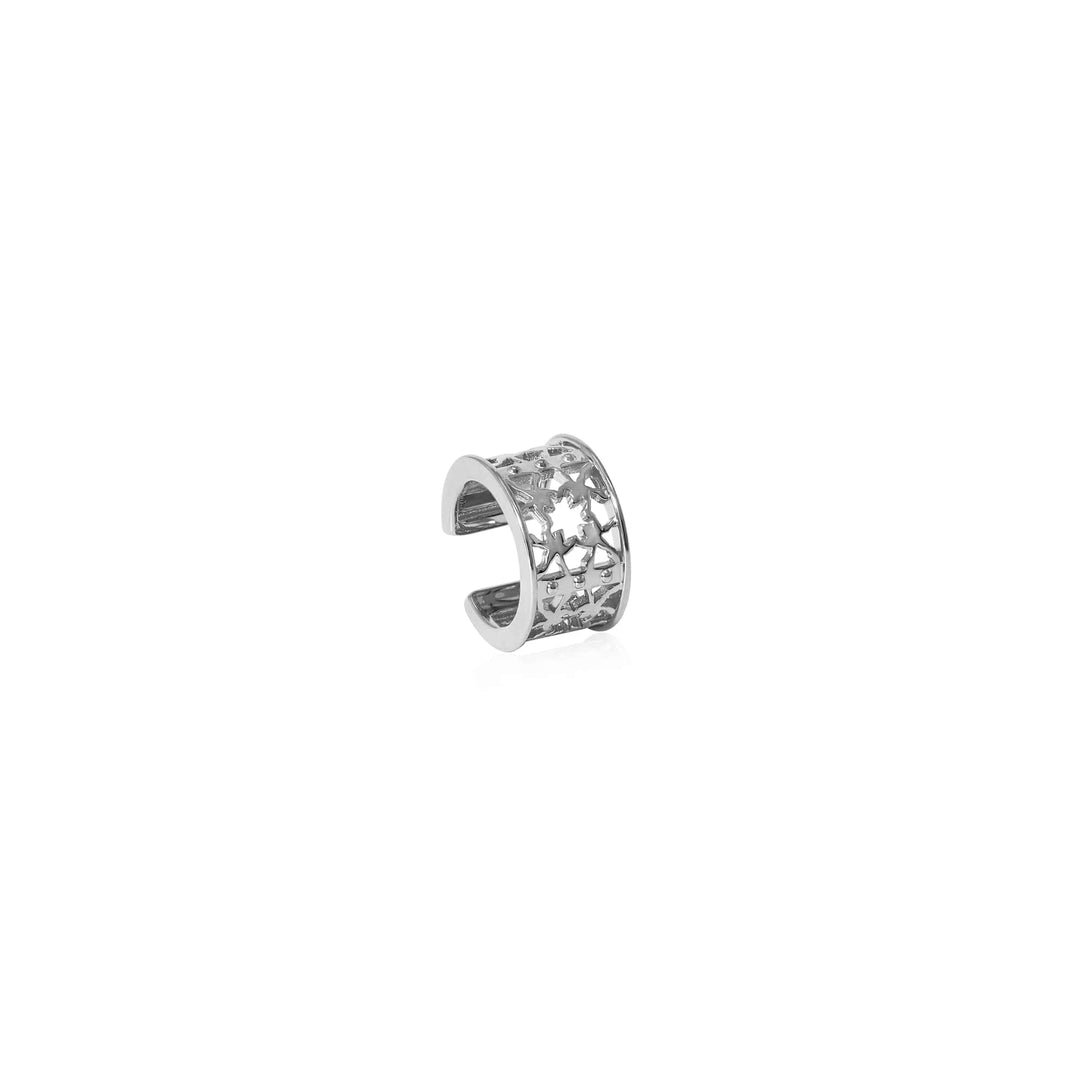 Risis Peranakan Orchid Ear Cuff (RH) - A silver, star-patterned ear cuff with an open-ended design and intricate cutouts creating a delicate, celestial appearance.