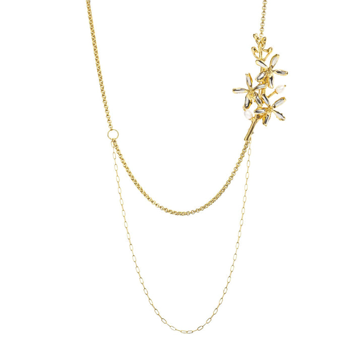 Risis Renantanda Symphony Necklace with Pearls - This is a gold necklace with a branched, leafy pendant adorned with small pearls, linked by a delicate chain with a looped design element.