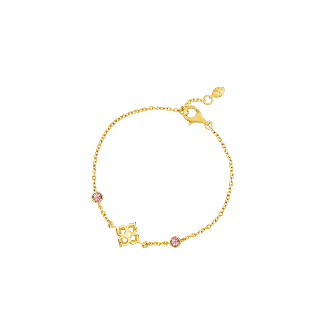 Risis Timeless Peranakan Bracelet With Pink Tourmaline - A delicate gold bracelet with a chain link design, featuring pink gemstone accents and a central gold charm with intricate cut-outs.
