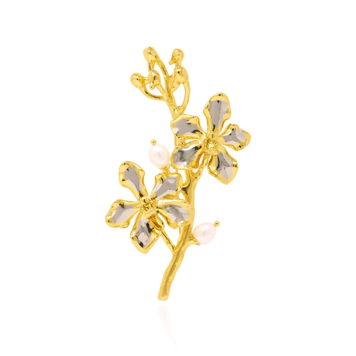 Risis Vanda Symphony Brooch with Pearls - A golden branch adorned with flowers; petals are shimmering, translucent stones, accented with small, lustrous pearls representing buds or dewdrops.