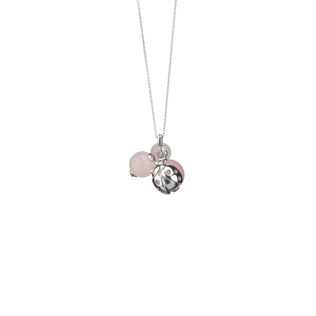 Risis Pond Ladybird Necklace - A silver necklace with a delicate chain features two pendants: a translucent pink bead and a metallic charm with a floral cut-out design.