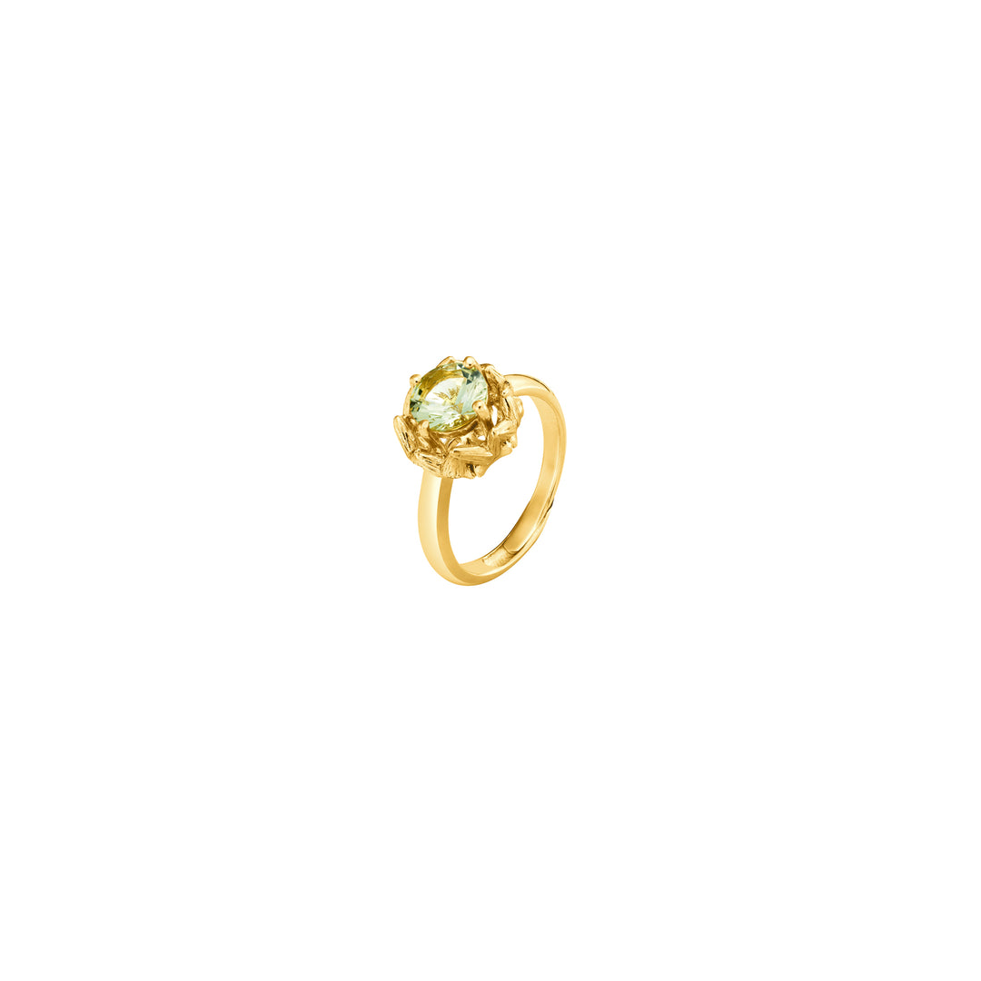Risis Midori Ring with Prasiolite - A golden ring featuring a large, multifaceted light green gemstone cradled in an intricate, floral-inspired setting.