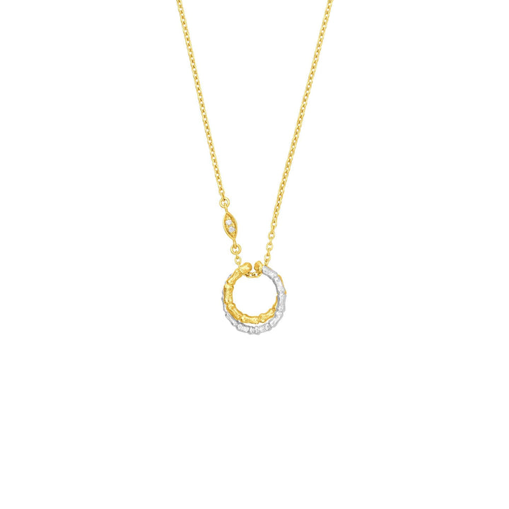 Risis Bamboo Twist Necklace with White Sapphires - A two-tone circular pendant hangs from a delicate gold chain, half embellished with sparkling clear gemstones, and half with textured gold detailing.