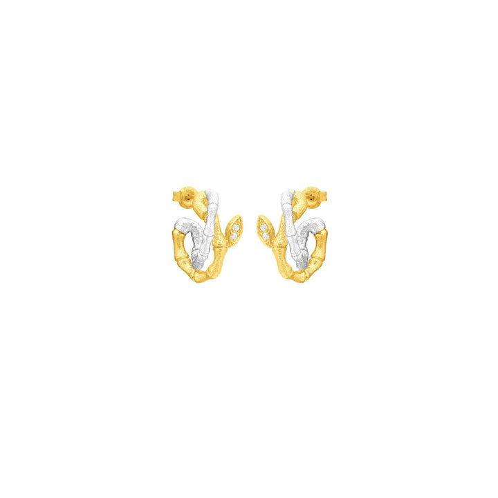Risis Bamboo Twist Pierced Earrings with White Sapphires - A pair of earrings with an abstract design, featuring textured gold and smooth silver elements, accented with small, clear gemstones.