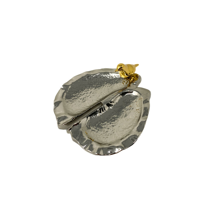 Risis Botanique Chestnut Bird Tray - Two delicate gold necklaces are suspended, one adorned with a simple bow and the other with a detailed, jewel-encrusted butterfly in silver, gold, and red hues.