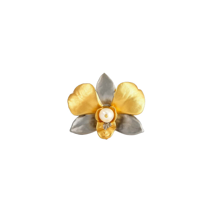 Risis Dendrobium Eleanor Chan Orchid Pearl Brooch - This is a metallic flower-shaped brooch with gold-tone and silver-tone petals. It features a pearl at the center, surrounded by a small, glistening stone.