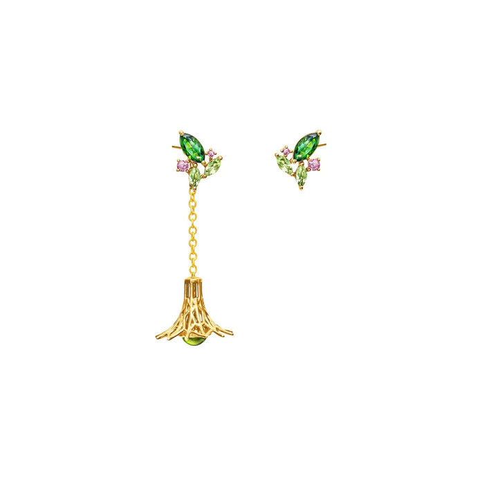 Risis Garden Odyssey Drop Earrings - A pair of gold earrings with marquise-cut emerald stones complemented by small purple gem accents dangles from a gold chain connected to a matching green jewel.