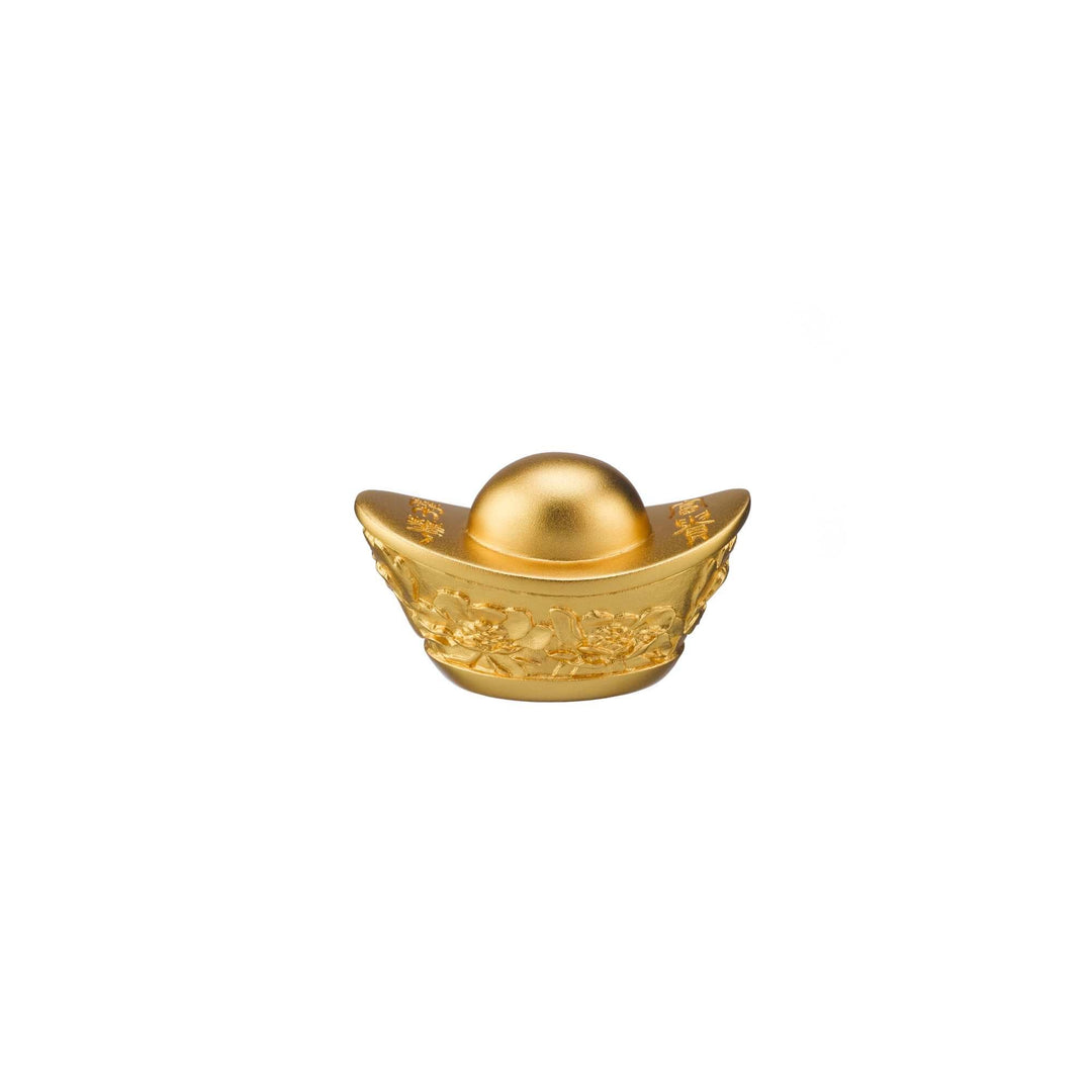 Risis Golden Yuan Bao - A matte golden sphere rests inside a glossy, ornate golden bowl decorated with relief patterns, suggestive of traditional Eastern art, symbolizing prosperity.