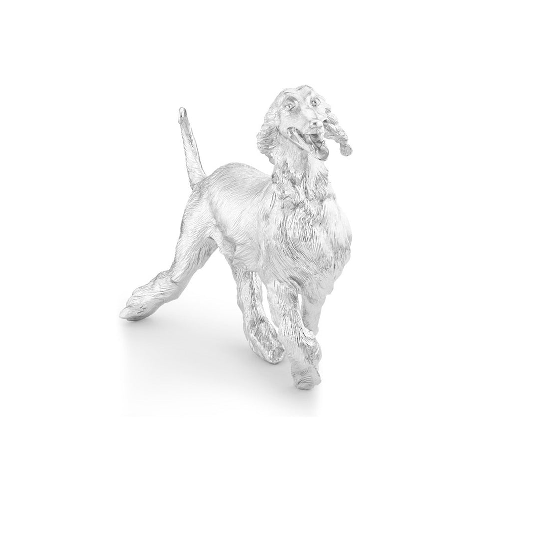 Risis Joy Dog - A metallic, silver figurine of a poised dog with detailed, textured fur and an expressive face, possibly in mid-stride or play.