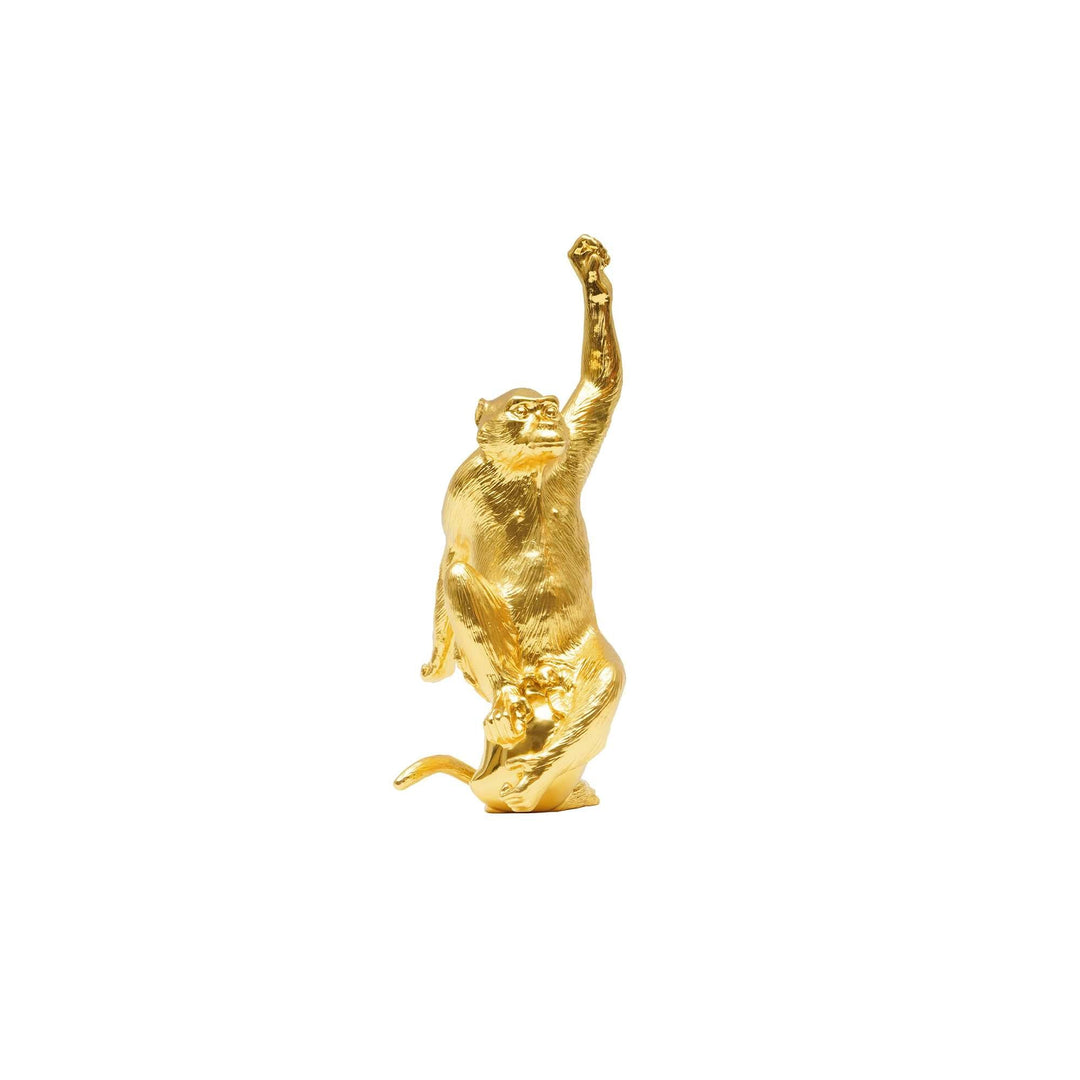 Risis Legend of XII - Monkey - A golden monkey sculpture with a shiny surface, captured mid-motion with one arm raised overhead.