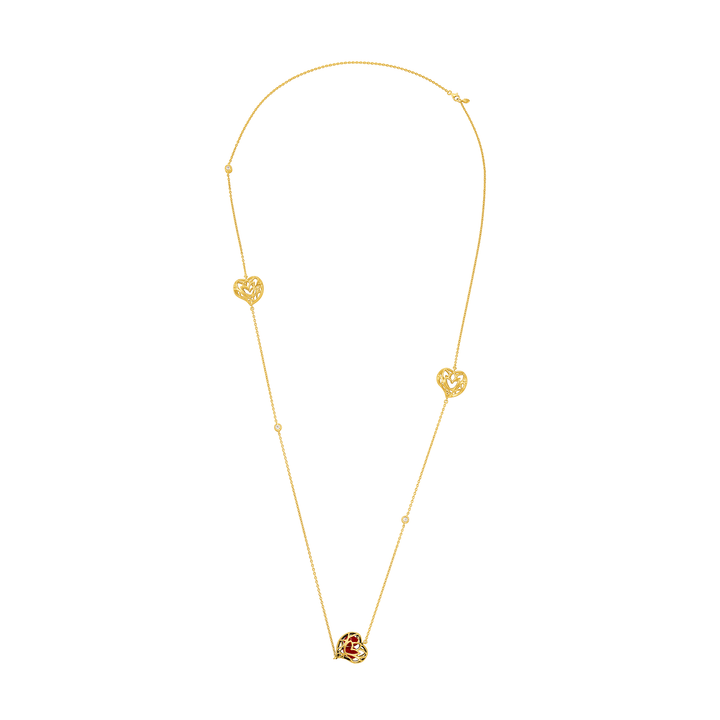 Risis Lotus Heart Saga Seed Long Necklace - A delicate gold necklace with two heart-shaped pendants and a central rose-shaped ornament, all connected by a fine chain.