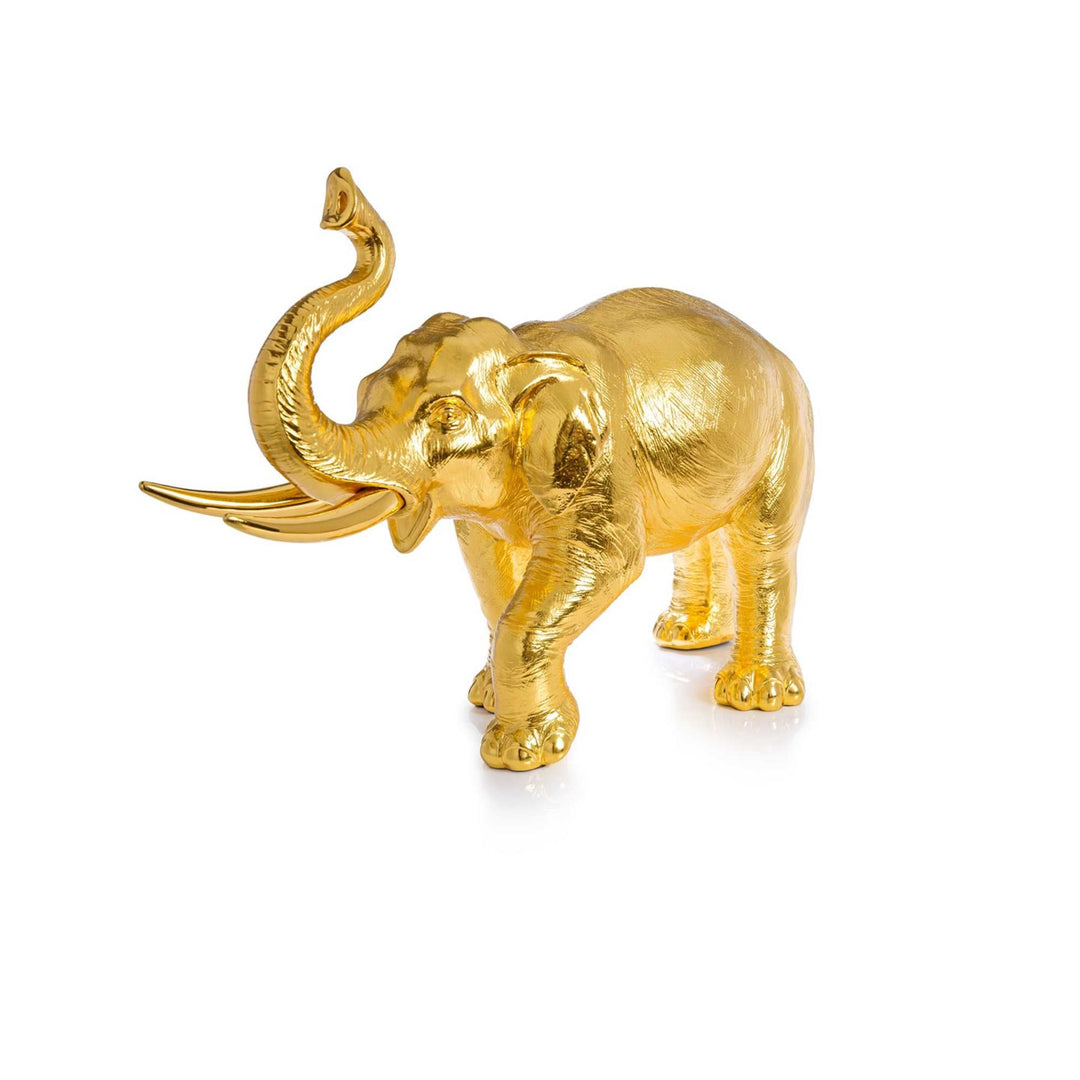 Risis Maharaja Elephant - A golden, shiny elephant figurine with raised trunk stands gracefully, its tusks elongated and curving outward.