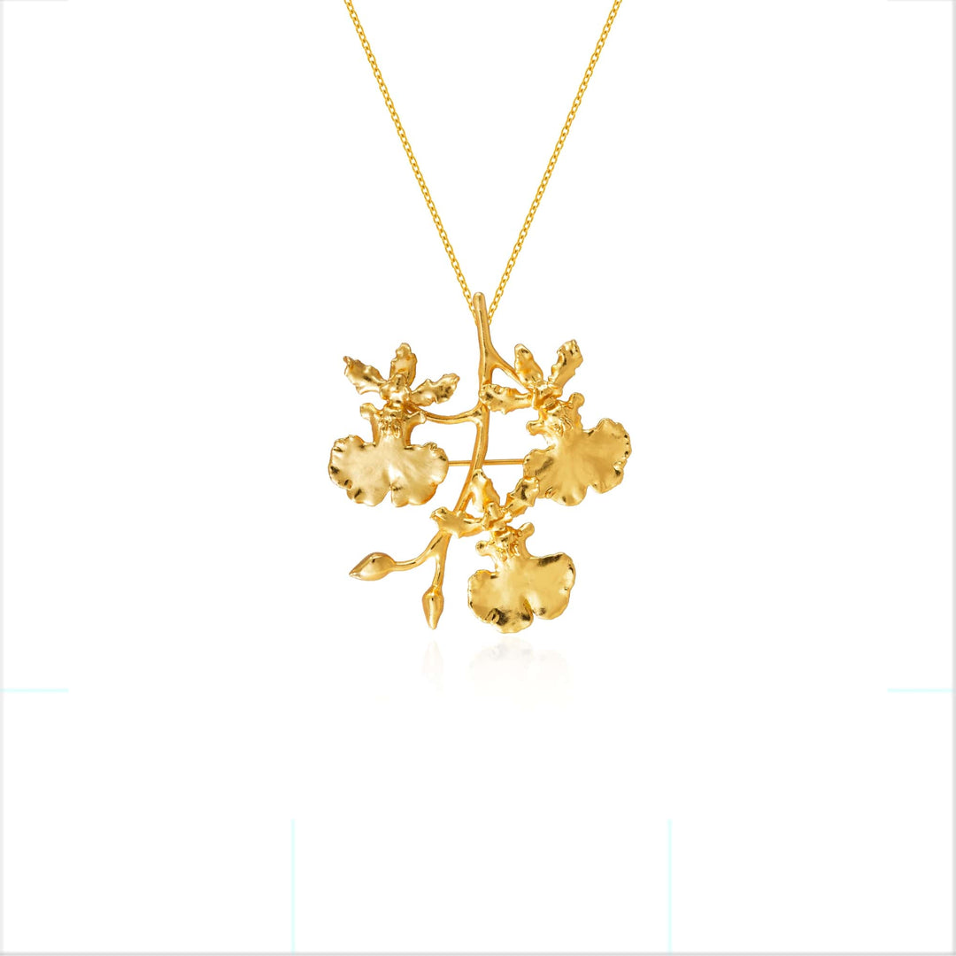 Risis Oncidium Shower Spray Brooch/Pendant (G) - A golden necklace featuring a detailed tree branch with textured leaves hangs centrally, reflecting light and showcasing elegance and craftsmanship.