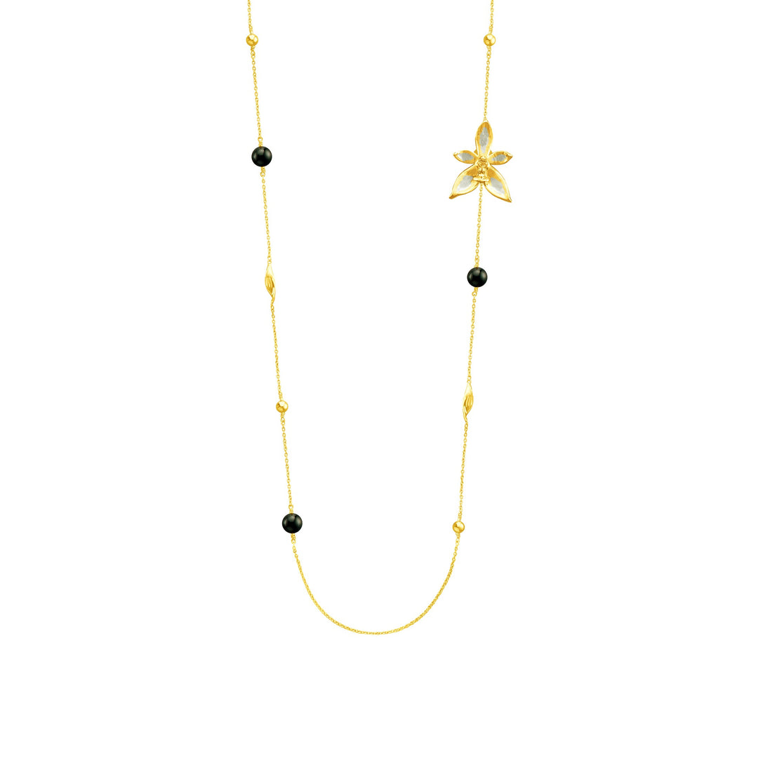 Risis Phalaenopsis Blossom Necklace - A delicate gold necklace with evenly spaced black beads and a central gold flower pendant, featuring intricate detailing.