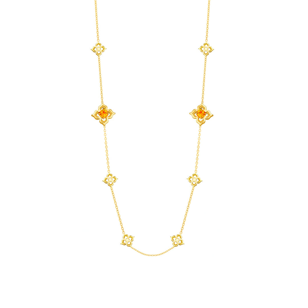 Risis Timeless Peranakan II Necklace (G) with Hessonite - A golden necklace features evenly spaced, intricate flower designs with orange centers, connected by thin links, creating an elegant and symmetrical piece of jewelry.