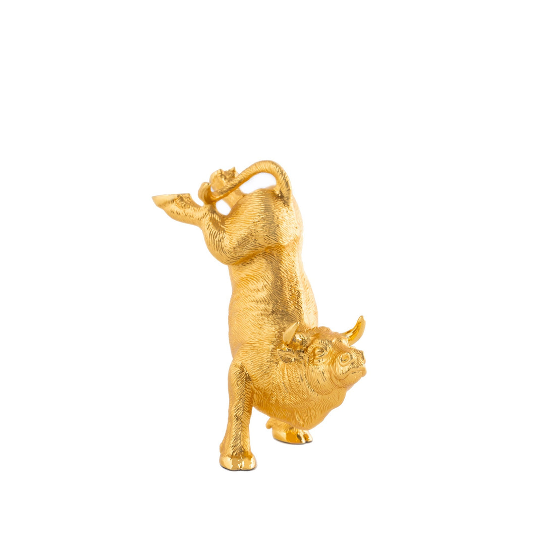 Risis Valour Ox - A golden, textured figurine of an upright bull with exaggerated muscles, a curved tail, and intricate horns, styled in an animated and whimsical manner.