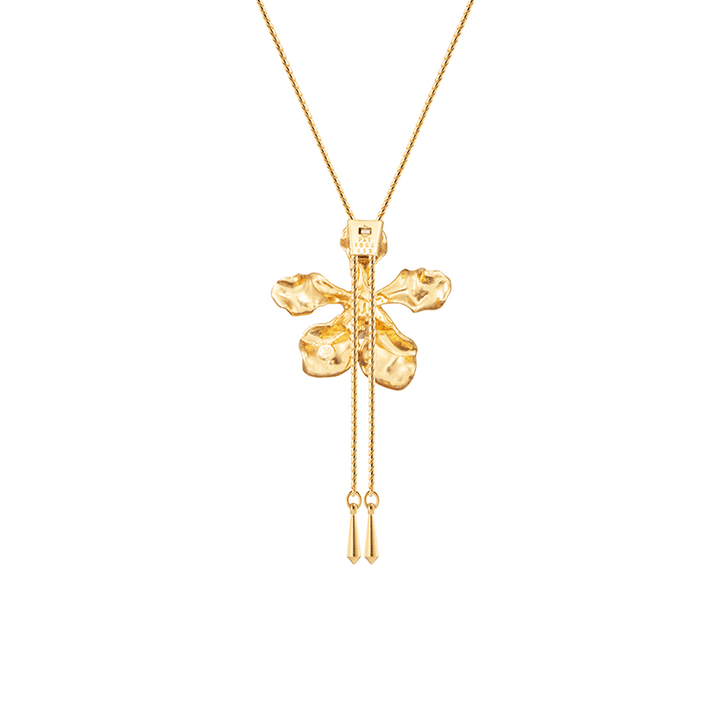 Risis Vanda Wee Kim Lian Orchid Slider Necklace (PG) - A golden pendant shaped like a four-leaf clover with a lustrous finish, highlighted by a small gemstone and delicate chains with miniature bar drops.