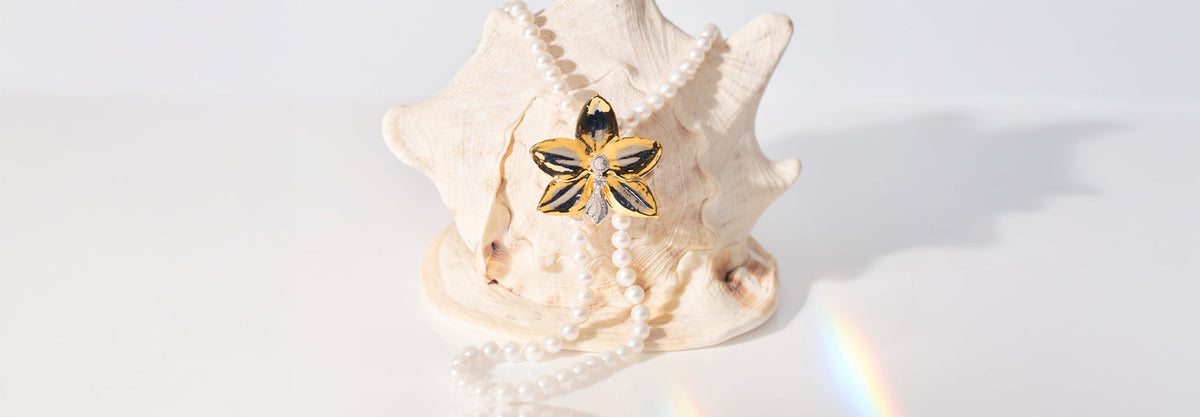 Natural Phalaenopsis Bellina Orchid Sonata Necklace and Brooch Encapsulated in 24K Swiss Gold and Palladium with Orchid's Tongue made from 925 Sterling Silver Encapsulated in Rhodium with Lab Grown Diamonds and Freshwater Pearls