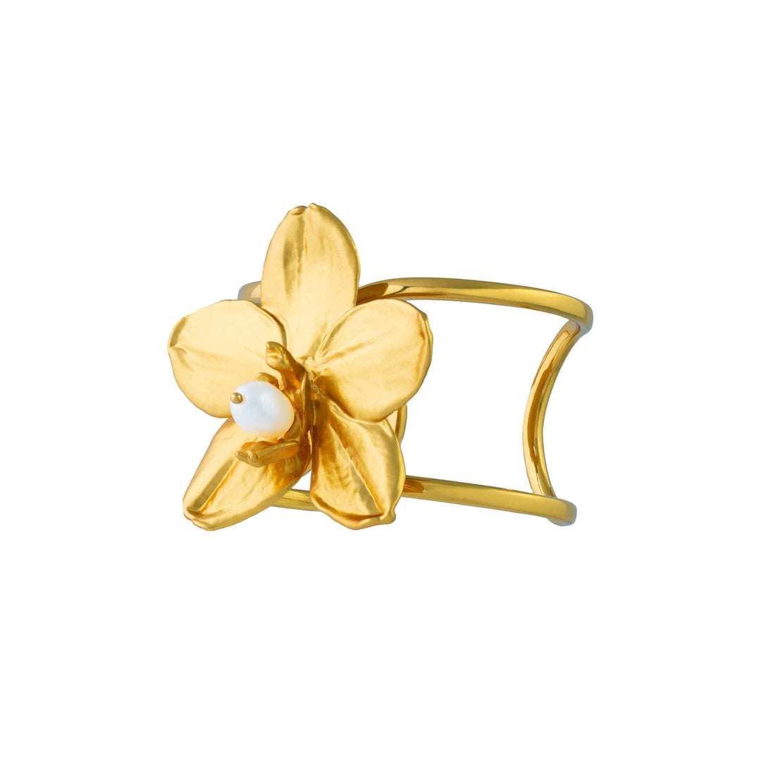 Risis 1974 Phalaenopsis Cuff Bangle - Gold-colored bracelet featuring a single, textured flower with a white pearl at its center, exuding elegance and simplicity.