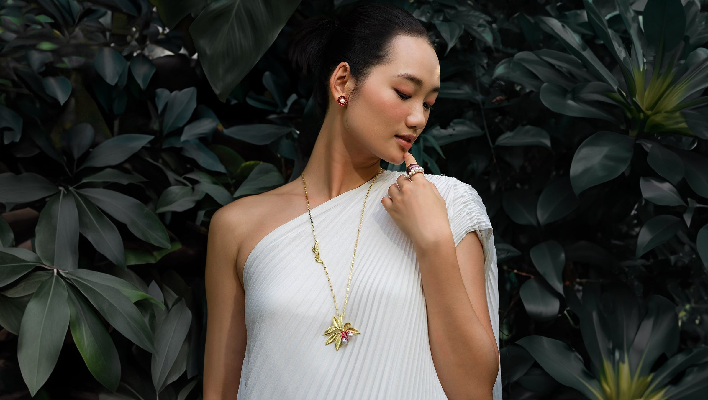 An Asian model posing with RISIS 2023 Autumn Winter Jewellery Collection