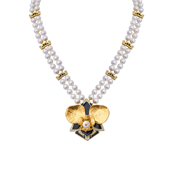 White pearl necklace with gold geometric links and gold flower drop pendant