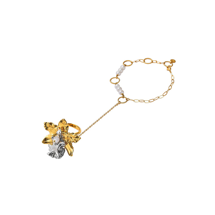 Gold-tone orchid hand chain bracelet with pearl beads and dangling flower charm