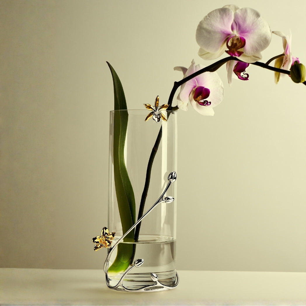 RISIS Orchid Designer Vase, Natural Kagawara Firebird Orchid Encapsulated in 24K Swiss Gold with Pewter Buds and Vines Encapsulated in Nickel, on a Glass Vase.