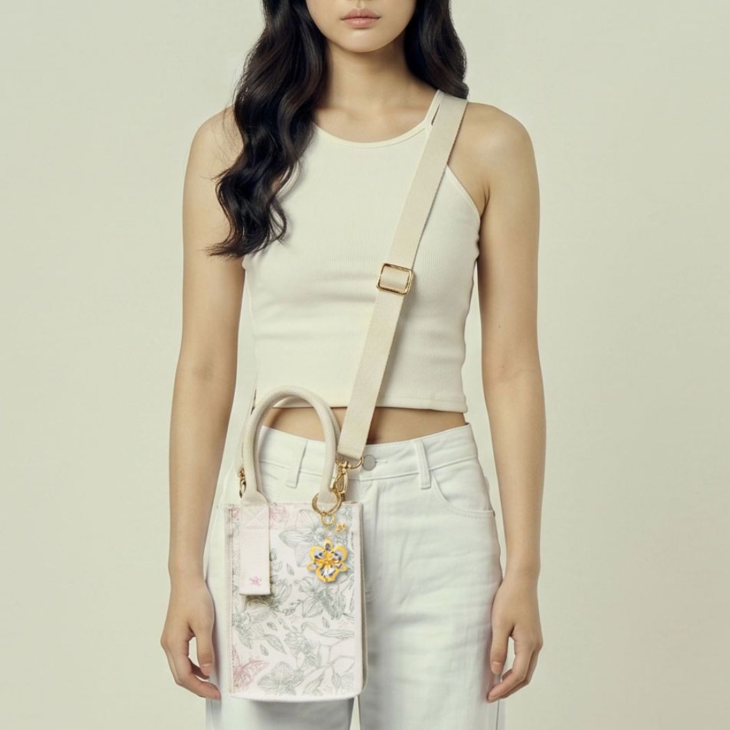 RISIS Orchid canvas mini tote bag worn as a hands-free crossbody bag