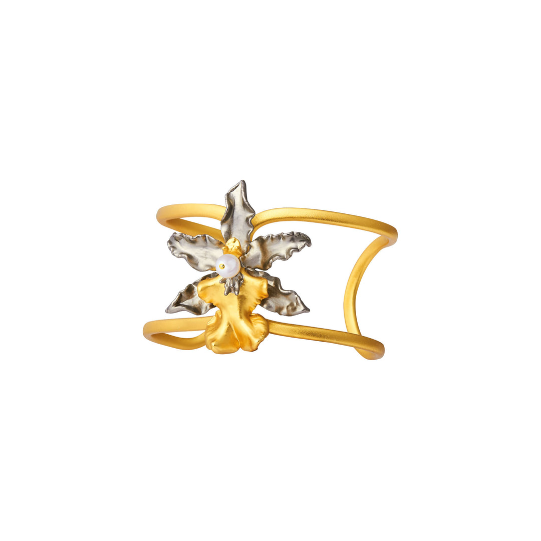 Gold-toned cuff bangle with arched floral design, silver petals, and white pearl