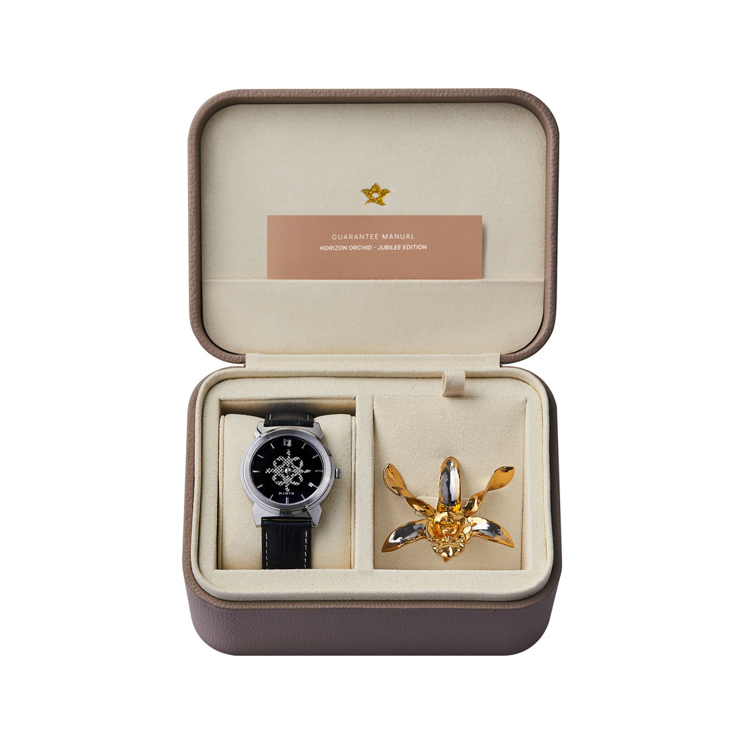 Gold orchid watch set in a padded display case with black leather strap