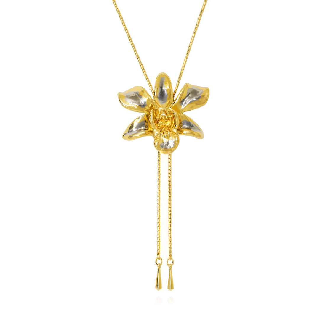 Risis Dendrobium Thong Chai Orchid Slider Necklace (PG) - A golden necklace with a flower pendant, featuring shiny petals and a central gemstone, accented by two dangling chains with small tassel ends.