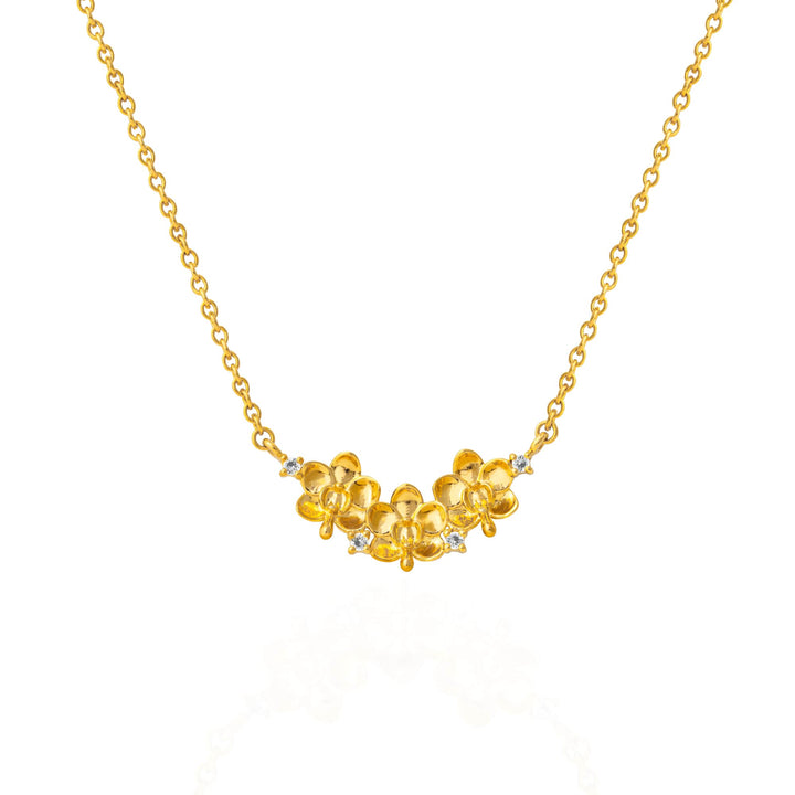 Risis Ascocenda Garden Necklace - A golden necklace with a delicate chain and a centerpiece of clustered golden flowers accented by small, sparkling gemstones.