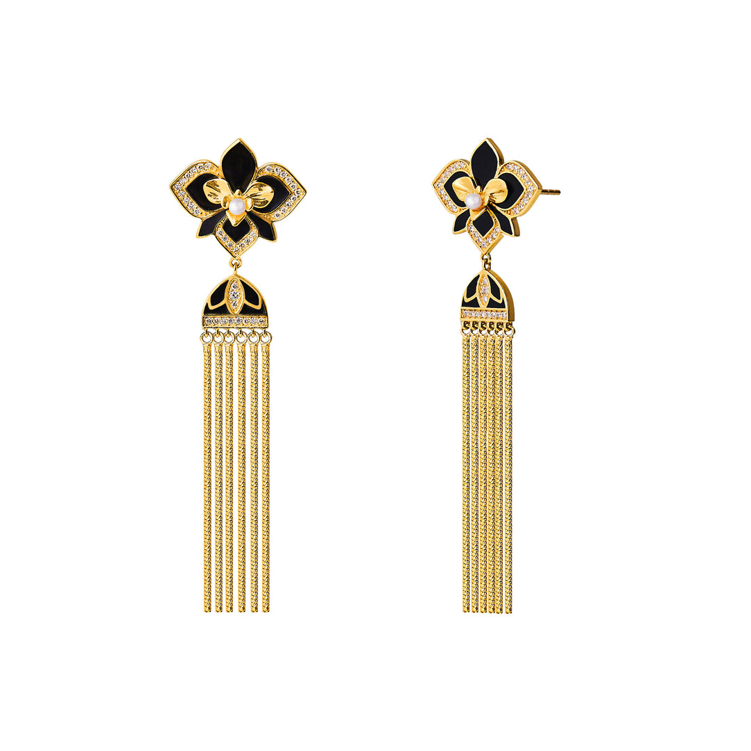 Art Deco orchid earrings with black enamel, pavé details, and long gold tassels