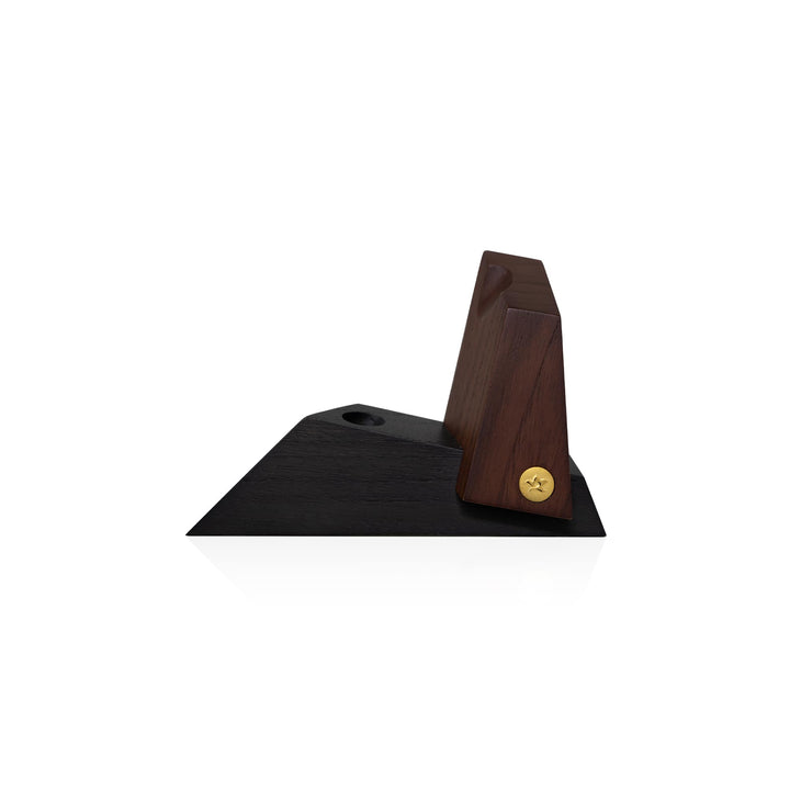 Risis Prism Pen Holder - A dark, angular wooden stand with a brass screw, designed to display or hold decorative objects, showcasing its smooth finish and minimalist design.