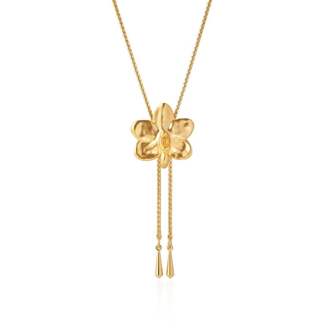 Risis Ascocenda Sagarik Orchid Slider Necklace (G) - A golden pendant shaped like a four-petaled flower with two delicate tassels dangling from its center, suspended on a matching chain.