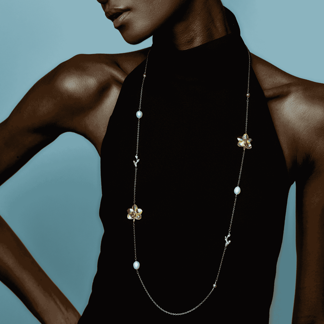 RISIS Blossom Long Necklace: Natural Ascocenda Orchids Encapsulated in 24K Swiss Gold and Palladium with Freshwater Pearls, and Encapsulated in 24K Swiss Gold with Type A Burmese Jadeite.
