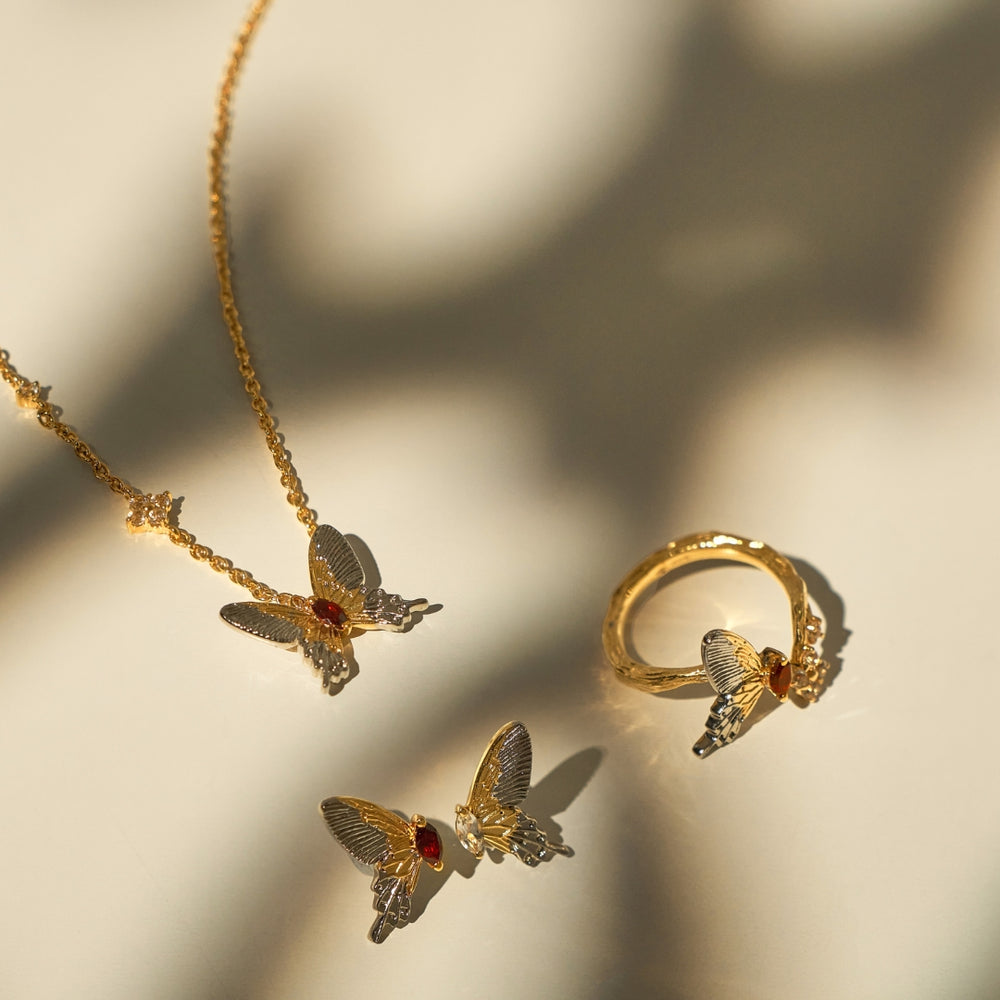 RISIS Botanique Butterfly Earrings, Necklace and Ring In Gold and Palladium - 925 Silver Encapsulated in 24K Swiss Gold and Palladium with Red Garnet and White Topaz