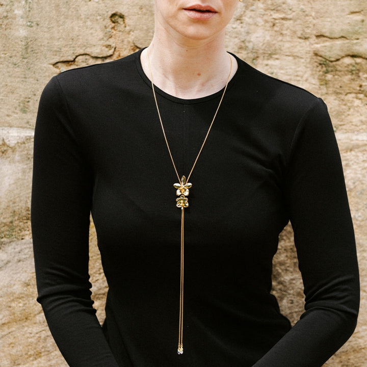 RISIS Dual Orchid Bloom Long Slider Necklace in 24K Gold & Palladium with Crystal Tailends