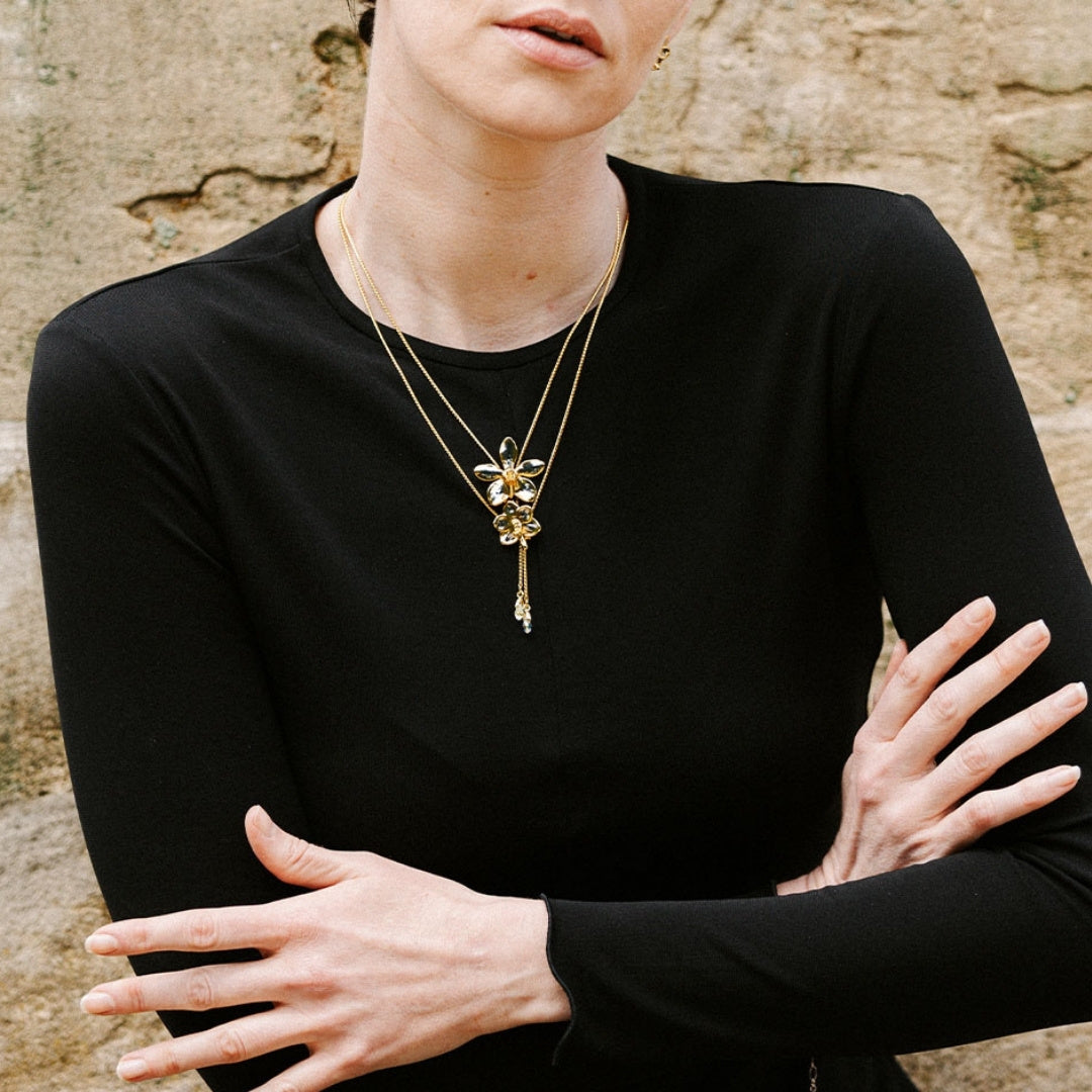 RISIS Dual Orchid Bloom Long Slider Necklace in 24K Gold & Palladium with Crystal Tailends 