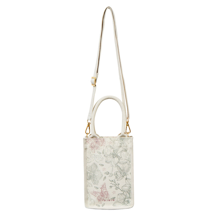 RISIS Orchid Canvas Mini Tote Bag. Designed for versatility, the bag comes with an optional strap, allowing for an effortless transition from handheld to crossbody wear.