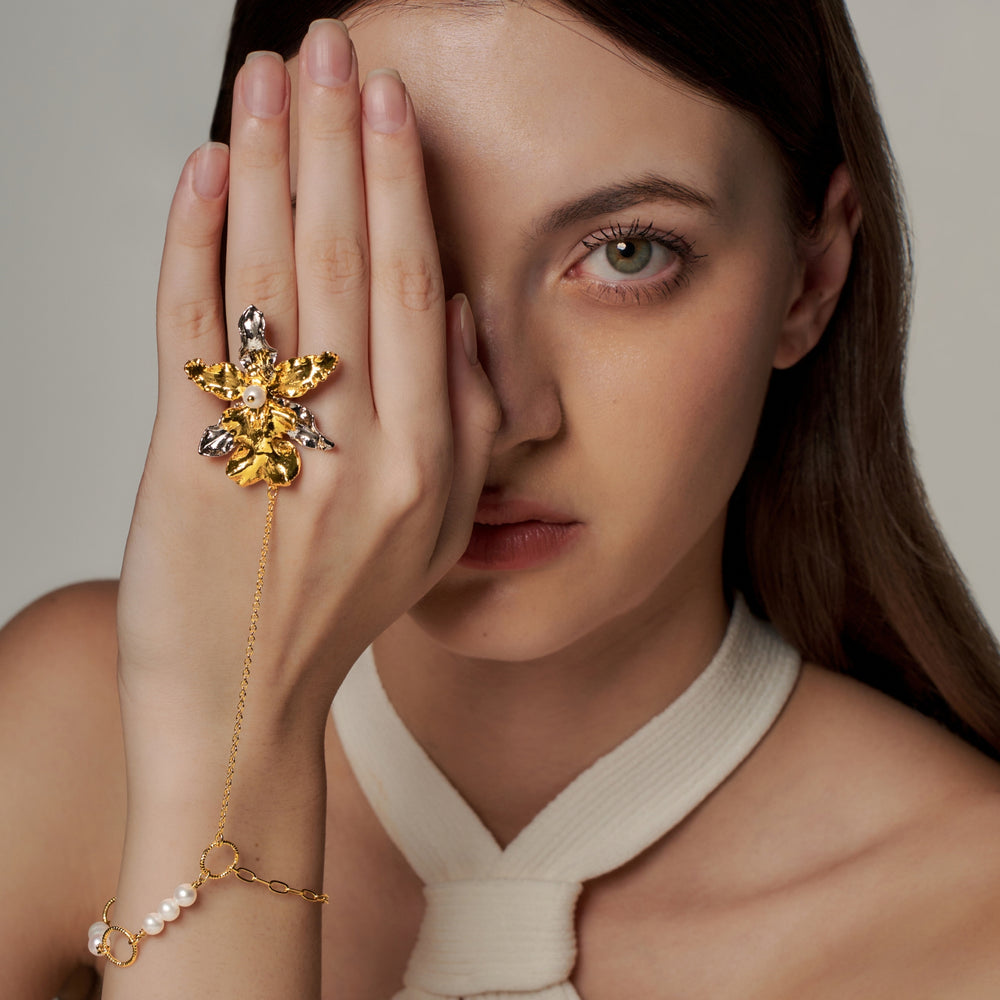 RISIS Ruby Orchid Hand Chain with Pearls, Natural Burrageara Guann Shin Rouge Ruby Orchid encapsulated in 24K Swiss Gold and Palladium with Freshwater Pearls