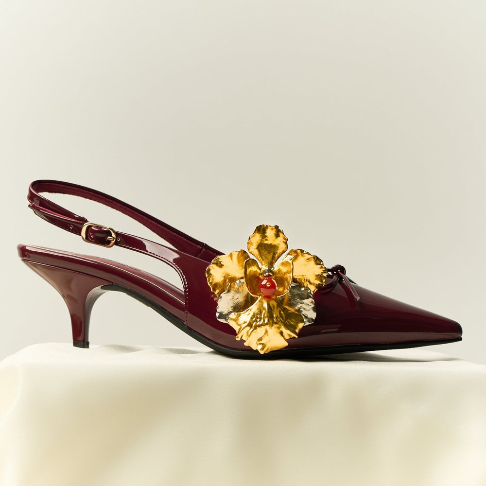 RISIS SG60 Iconic Vanda Miss Joaquim Orchid Brooch, natural orchid encapsulated in 24K Swiss Gold and Palladium with Red Agate