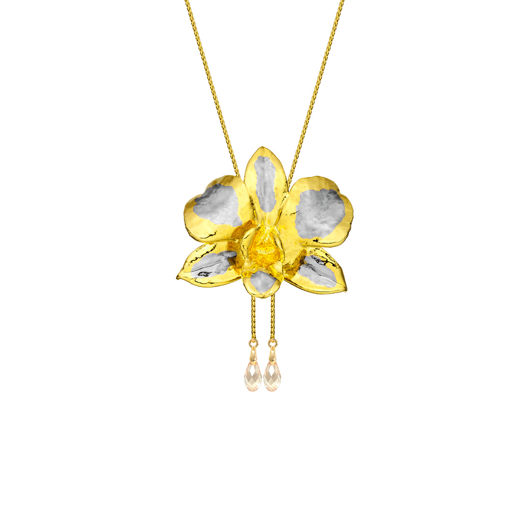 Risis Dendrobium Eleanor Chan Orchid Slider Rhg - A gold-colored necklace with a five-petaled flower pendant featuring silver accents and a translucent yellow center; two teardrop crystals dangle below on fine chains.